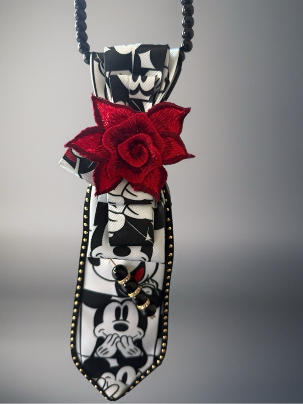 Black & White Cartoon Pendant Necklace with Red Floral Accent
